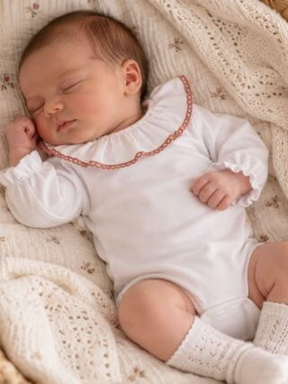 Bodysuit with ruffles and lace.